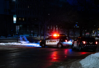 Outside the Warren E. Burger Federal Building on Day 3 of the federal trial where Thou Thao, J Alexander Kueng and Thomas Lane are accused of violating George Floyd's civil rights. St. Paul police block road in front of courthouse as a car caravan protest makes it's way through downtown.