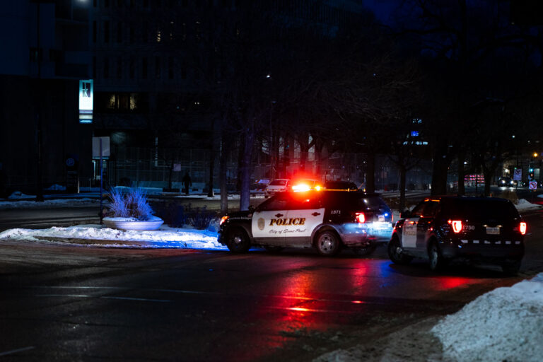 St. Paul Police Squad Cars 4 Outside the Warren E. Burger Federal Building on Day 3 of the federal trial where Thou Thao, J Alexander Kueng and Thomas Lane are accused of violating George Floyd's civil rights. St. Paul police block road in front of courthouse as a car caravan protest makes it's way through downtown.