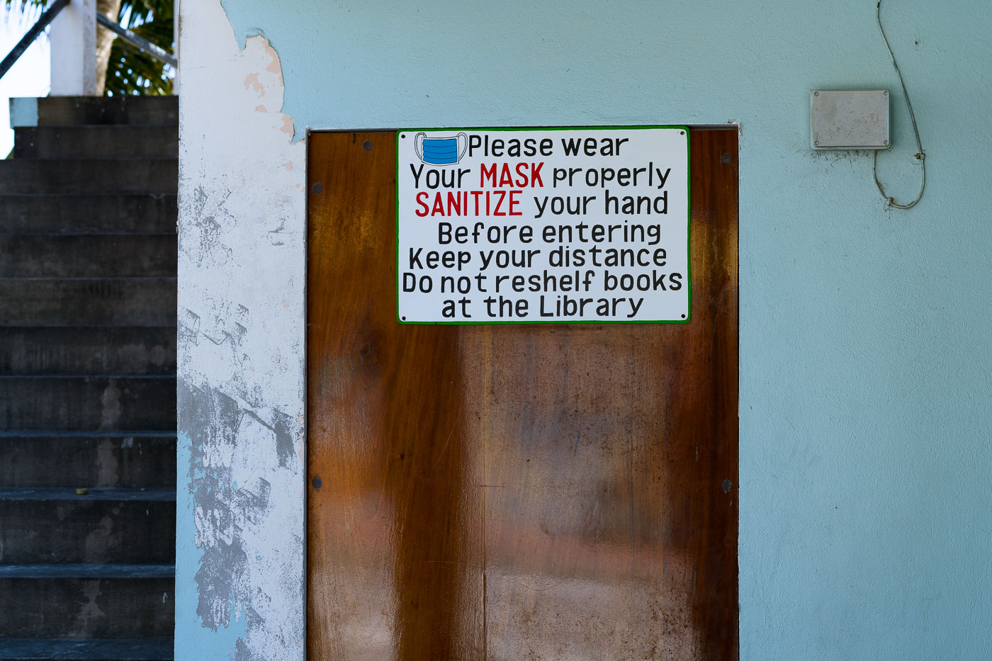 COVID sign in San Pedro, Ambergris Caye Belize