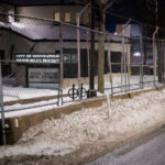 Minneapolis Police Fourth Precinct Police Station behind security fencing in January 2022.
