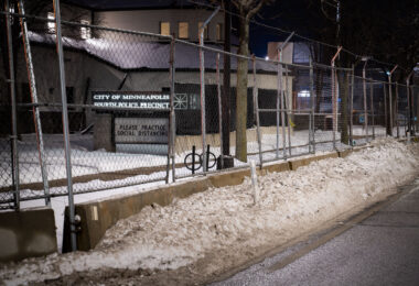 Minneapolis Police Fourth Precinct Police Station behind security fencing in January 2022.