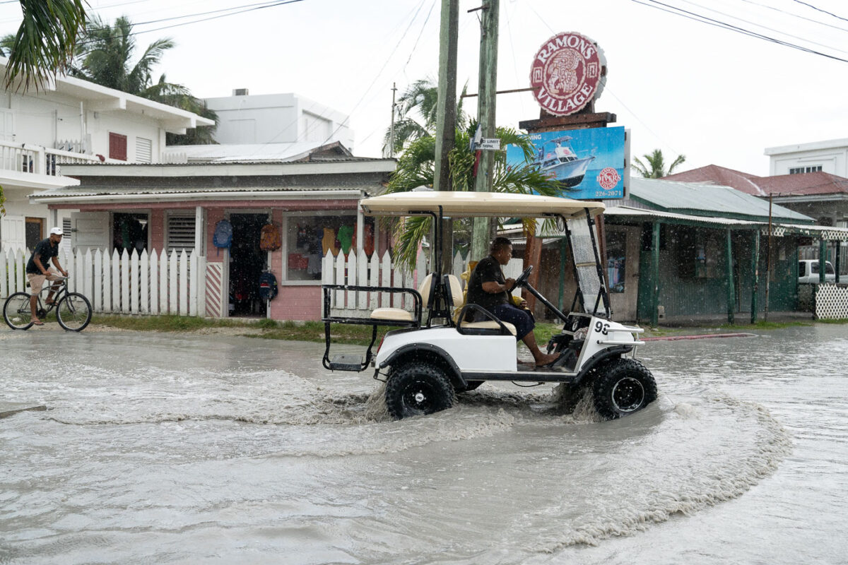 A golf cart is driven in a San Pedro rain storm.