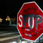 A stop sign with graffiti on it in Minneapolis. "FTP", standing for "Fuck The Police".