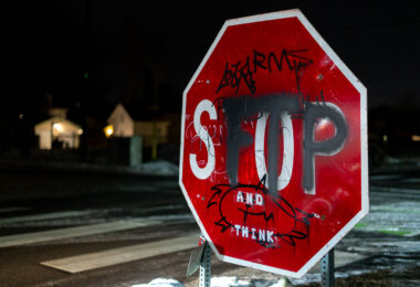 A stop sign with graffiti on it in Minneapolis. "FTP", standing for "Fuck The Police".
