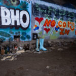 A memorial for a local activist with "no cops in heaven" painted on the walls.