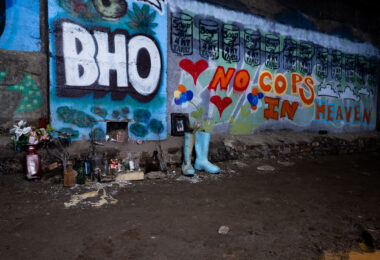 A memorial for a local activist with "no cops in heaven" painted on the walls.