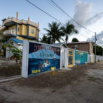 A bar and grill called "John's Escape" on what was once John McAfee's property.