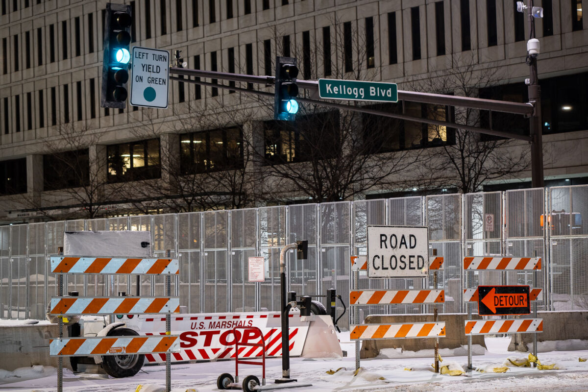 Security around the Warren E. Burger Federal Building in downtown St. Paul the night before opening statements in the trial of the officers accused of violating George Floyd's civil rights.