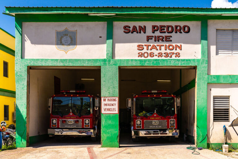 San Pedro Fire Station 4 The San Pedro Fire Station on Ambergris Caye serves as the primary emergency response hub for the island’s growing community and tourism corridor. Operated under the National Fire Service of Belize, the small but vital station houses a pair of Mack fire engines that support firefighting and rescue operations in the densely built town center and along the island’s coastal neighborhoods. With limited road infrastructure and many buildings constructed from wood, the station plays an essential role in protecting residents, resorts, and local businesses across one of Belize’s busiest islands.
