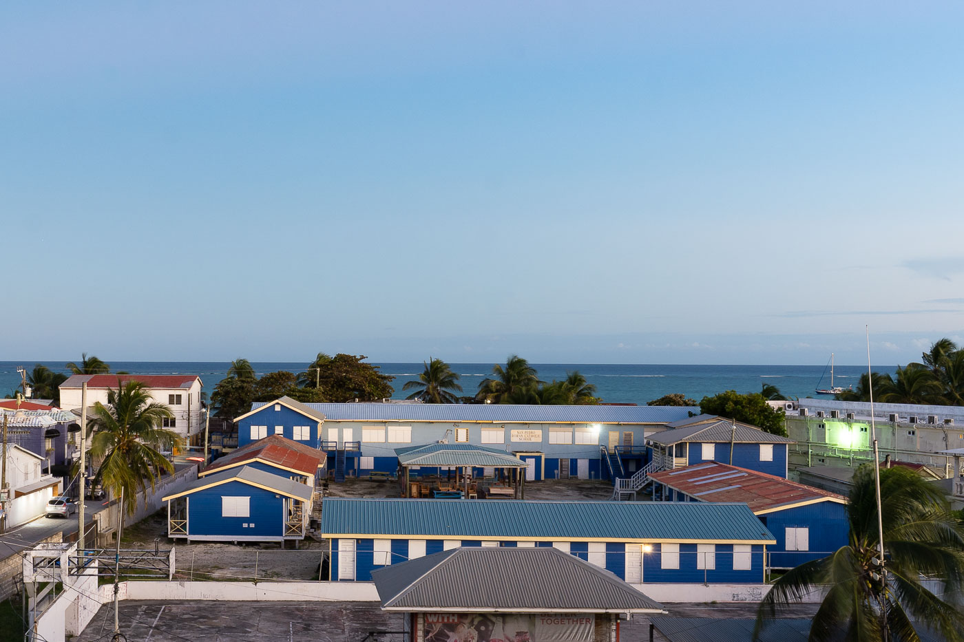 San Pedro Roman Catholic School on Ambergris Caye, Belize, provides primary and secondary education in Caribbean-style blue buildings.