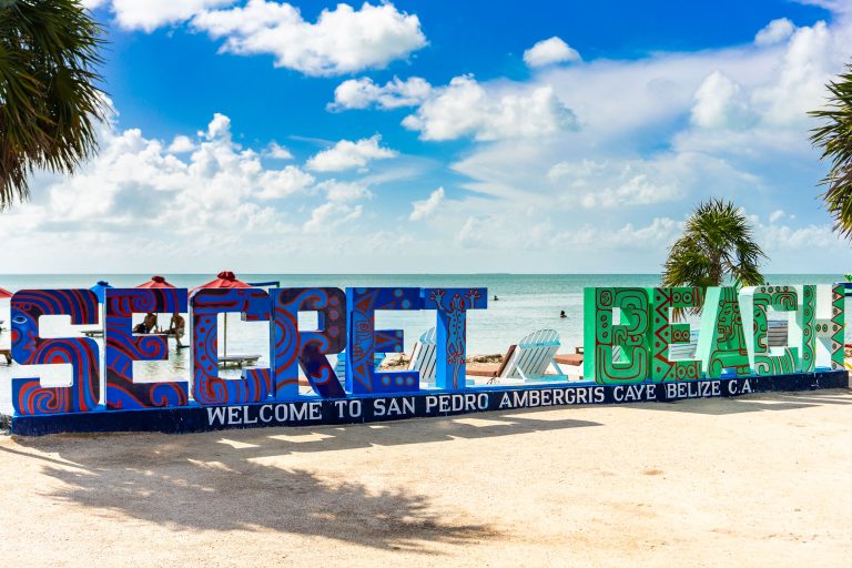 Secret Beach Sign, San Pedro, Ambergris Caye, Belize 3 Large colorful "Secret Beach" sign welcomes visitors to San Pedro, Ambergris Caye, Belize.