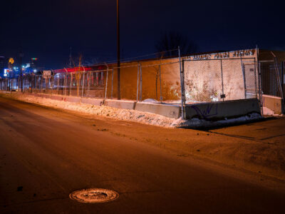 Minneapolis Police 5th Precinct Behind Fencing at Night