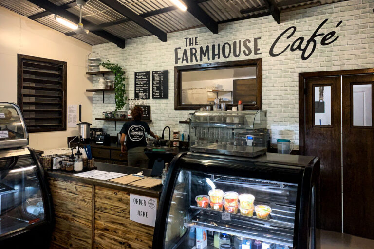 The Farmhouse Cafe Interior, San Pedro, Ambergris Caye 1 The Farmhouse Cafe interior in San Pedro, Ambergris Caye, Belize, features rustic wood and brick walls, serving as a local gathering spot.