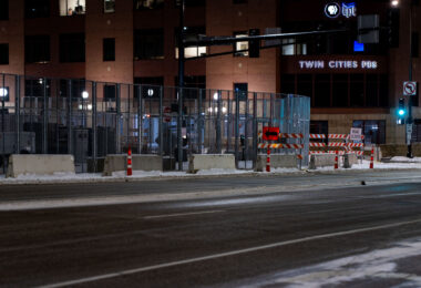 Security around the Warren E. Burger Federal Building in downtown St. Paul the night before opening statements in the trial of the officers accused of violating George Floyd's civil rights. Located across the street from Twin Cities PBS.