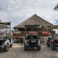 Golf carts parked outside Ugly Duck Sports Bar & Grill in San Pedro on Ambergris Caye in Belize.