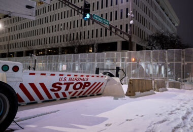 Security around the Warren E. Burger Federal Building in downtown St. Paul the night before opening statements in the federal trial of the officers accused of violating George Floyd's civil rights.