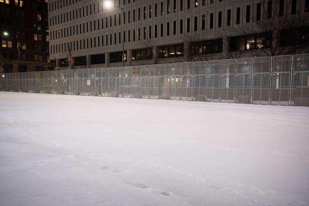 Security around the Warren E. Burger Federal Building in downtown St. Paul the night before opening statements in the trial of the officers accused of violating George Floyd's civil rights.