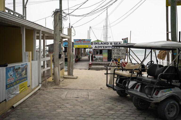 X SITE Belize Sailing and Adventures 2 Golf Carts parked on Ambergris Caye in San Pedro Belize.