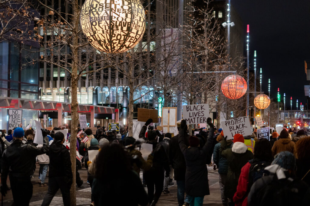 Protesters march through Downtown Minneapolis after demanding the Mayor resign following the Minneapolis Police shooting death of Amir Locke during a no-knock search warrant.