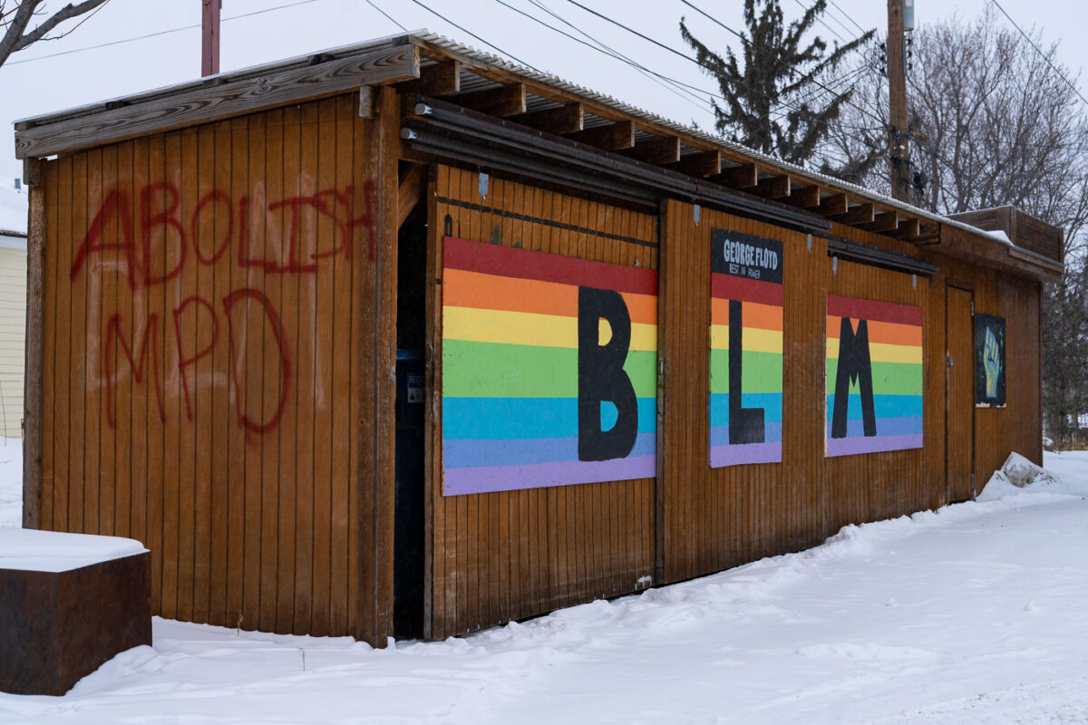 "Abolish MPD" and "BLM" painted on a building on 38th Street.