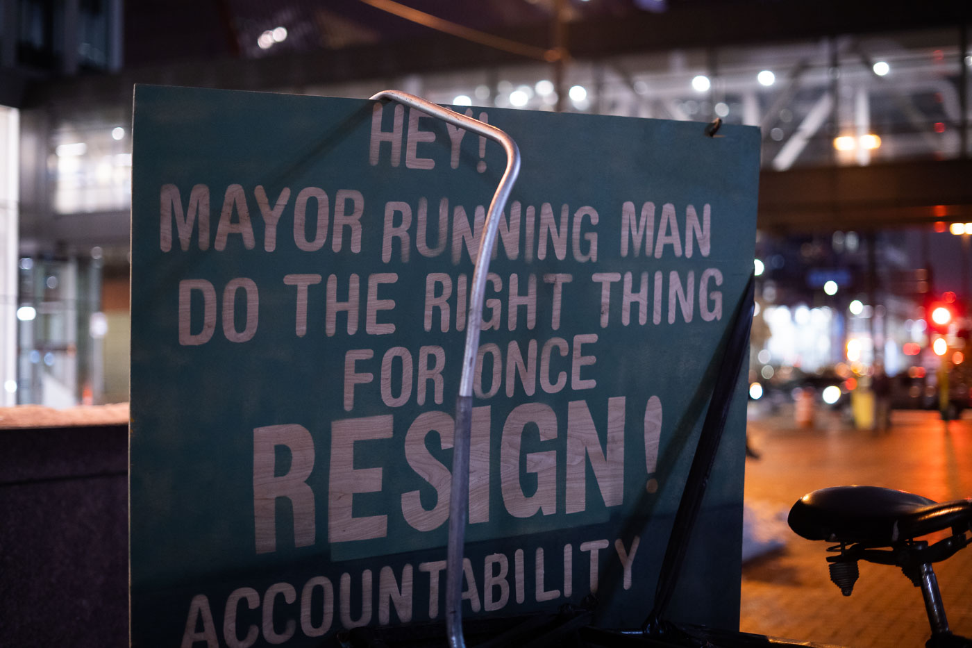 A protest sign in Downtown Minneapolis calls for Mayor Jacob Frey to resign following the police shooting death of Amir Locke. The sign, displayed during a march, demands accountability and criticizes the mayor's response to the incident. Amir Locke was killed on February 2, 2022, during a no-knock warrant execution by the Minneapolis Police Department. This event intensified public scrutiny of law enforcement practices and led to widespread calls for reform.