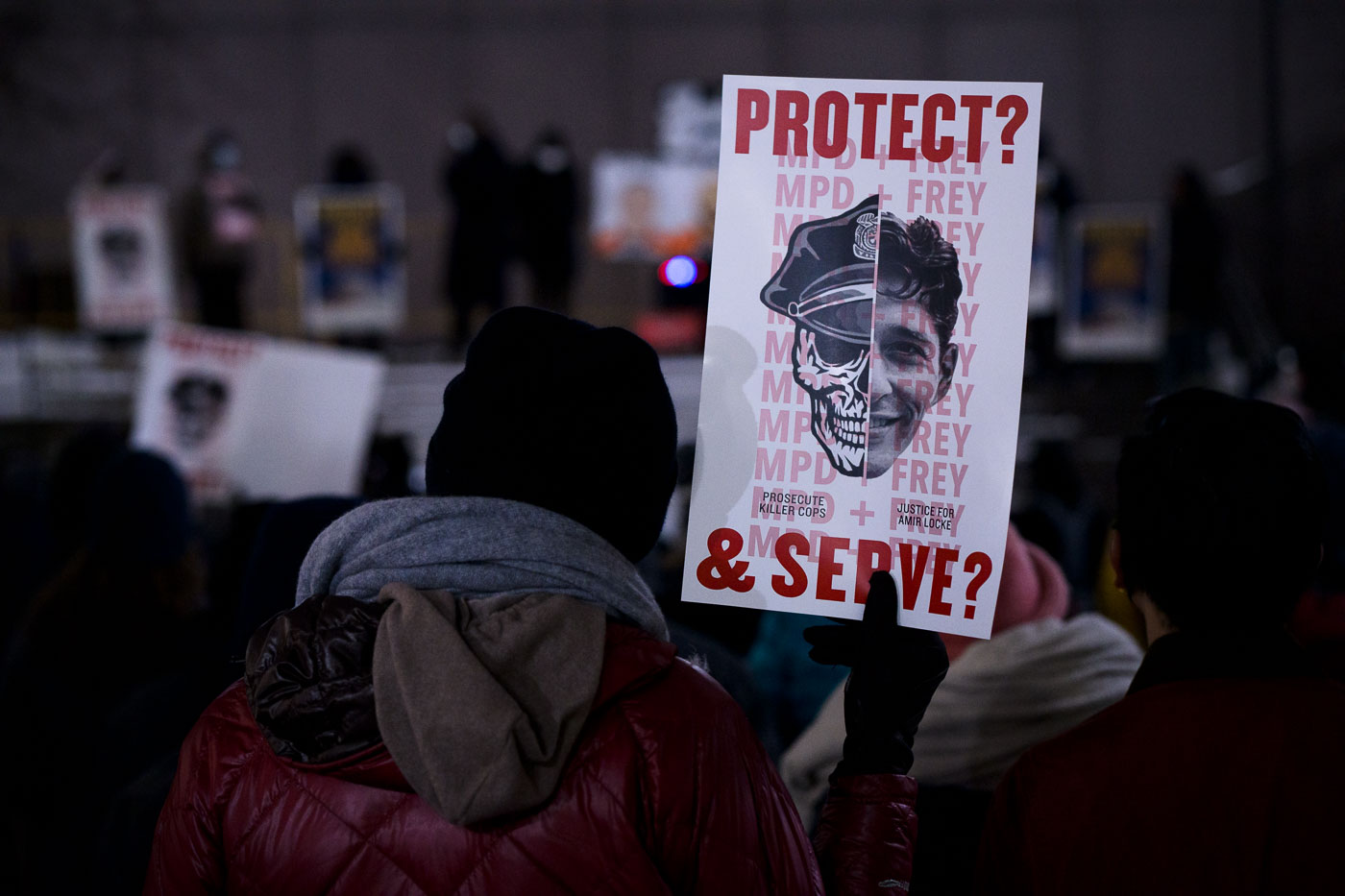 Protesters gathered in Downtown Minneapolis to demand accountability from the Minneapolis Police Department and Mayor Jacob Frey following the fatal shooting of Amir Locke. Locke was killed on February 2, 2022, during the execution of a no-knock search warrant. The protest, held in the aftermath of the incident, featured signs questioning the role of law enforcement, such as one reading "PROTECT? MPD + FREY & SERVE?" with the slogan "JUSTICE FOR AMIR LOCKE" and "PROSECUTE KILLER COPS." This event highlighted ongoing tensions between the community and police in Minneapolis.