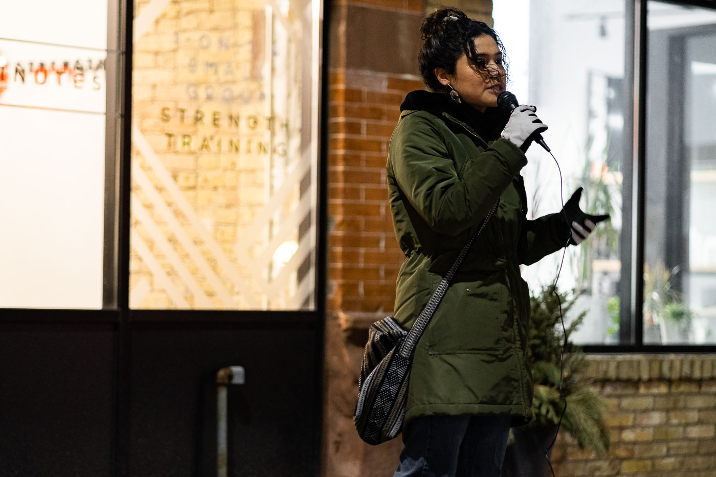 A speaker addresses a crowd outside the Minneapolis Mayor's residence in Northeast Minneapolis, calling for justice for Amir Locke. The protest occurred following the fatal shooting of Locke by Minneapolis police officers during a no-knock warrant execution in February 2022. This event highlights ongoing community concerns regarding police conduct and accountability in the city.