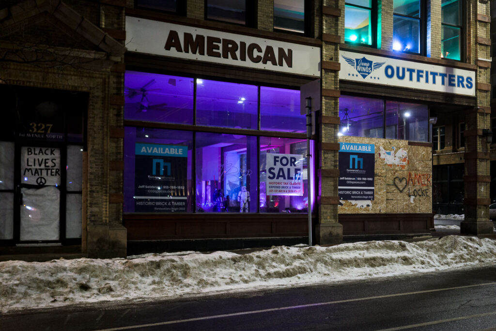 Boards on the former American Outfitters store in downtown Minneapolis.
