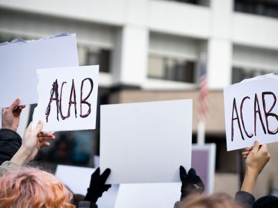 Amir Lock Student March, ACAB Protest Signs