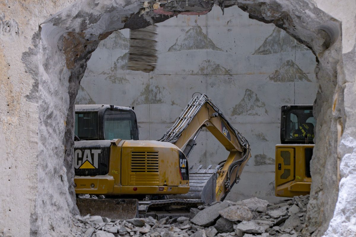 Cat Excavator Through Broken Concrete, I-35W Stormwater Storage Facility