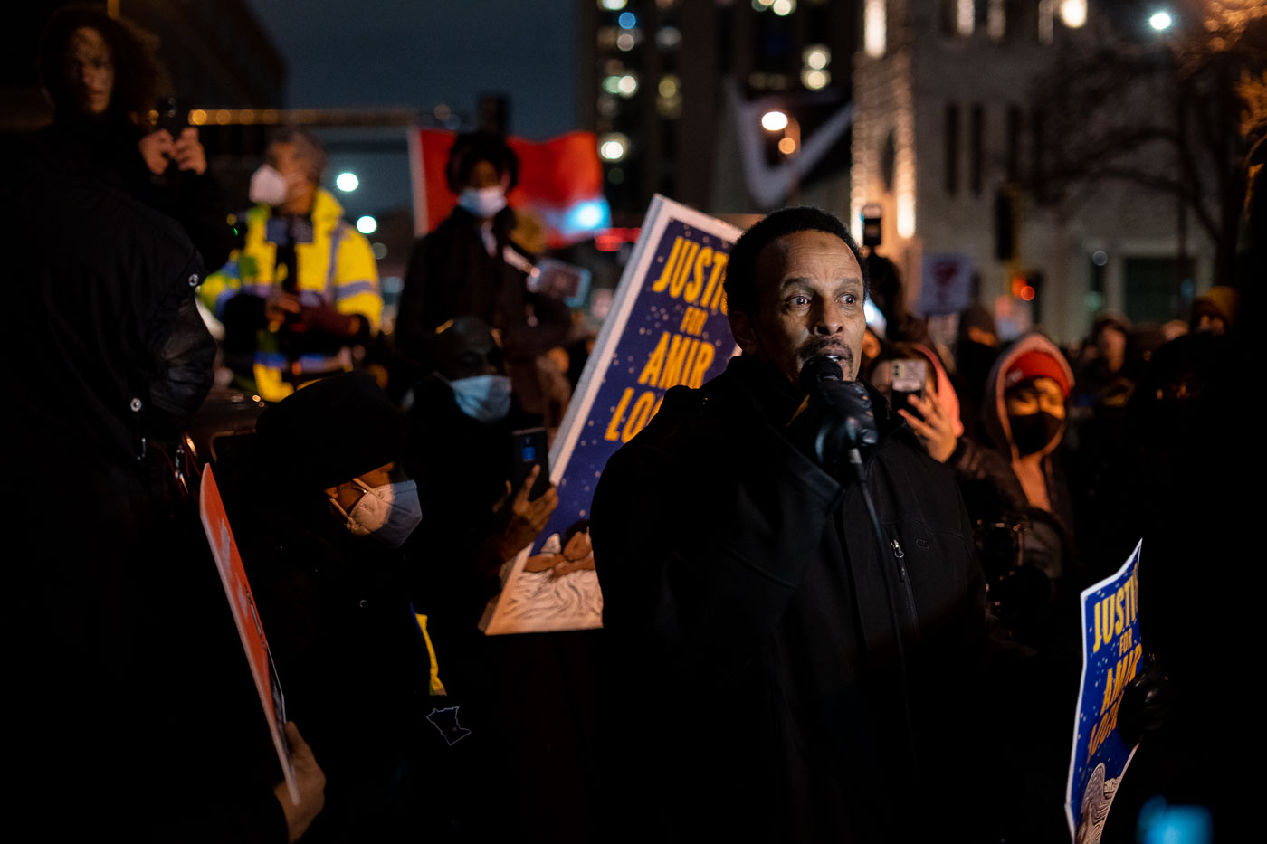 Dolal Idd, father of Amir Locke, speaks to a crowd during a protest in Downtown Minneapolis. The march occurred following the death of Amir Locke, who was killed by Minneapolis police during a no-knock warrant execution on February 2, 2022. This event was part of a broader series of protests and demonstrations in Minneapolis concerning police conduct and accountability.