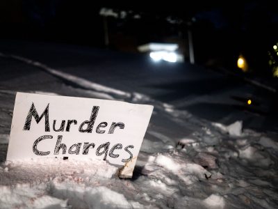 Murder Charges sign in the snow, Amir Locke killing