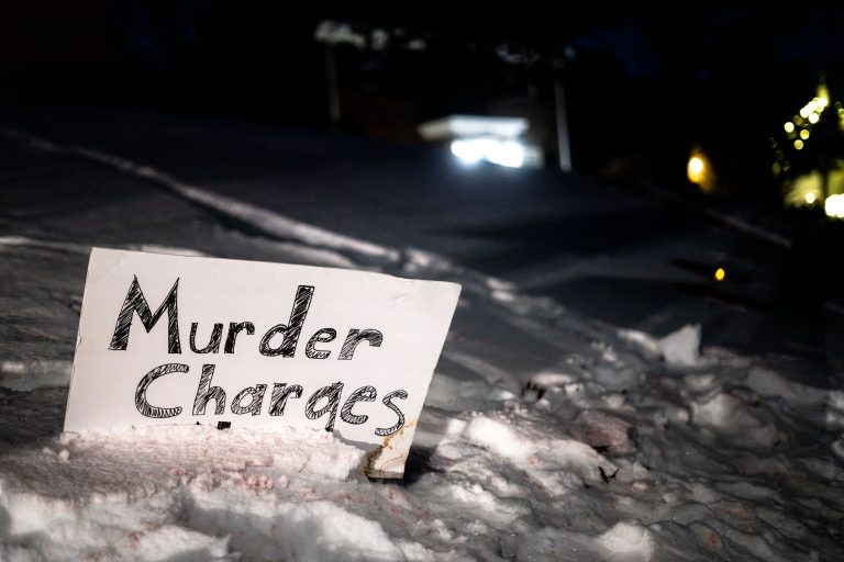 Murder Charges sign in the snow, Amir Locke killing 4 Sign in the snow that reads Murder Charges, Amir Locke Killing