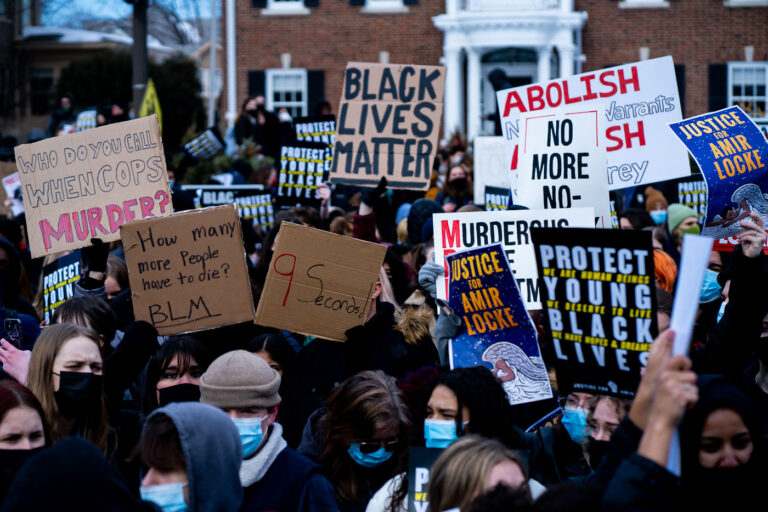 St. Paul Protest Demands Justice for Amir Locke 2 Protesters gathered outside the Minnesota Governor's Mansion in St. Paul to demand justice for Amir Locke, who was killed by Minneapolis police. The protest also called for the resignation of Minneapolis Police Chief Amelia Huffman and Mayor Jacob Frey. Signs displayed messages such as "Black Lives Matter," "Abolish No More Warrants," and "9 Seconds," referencing the circumstances of Locke's death. This event highlighted ongoing concerns about police conduct and racial justice in the Twin Cities.