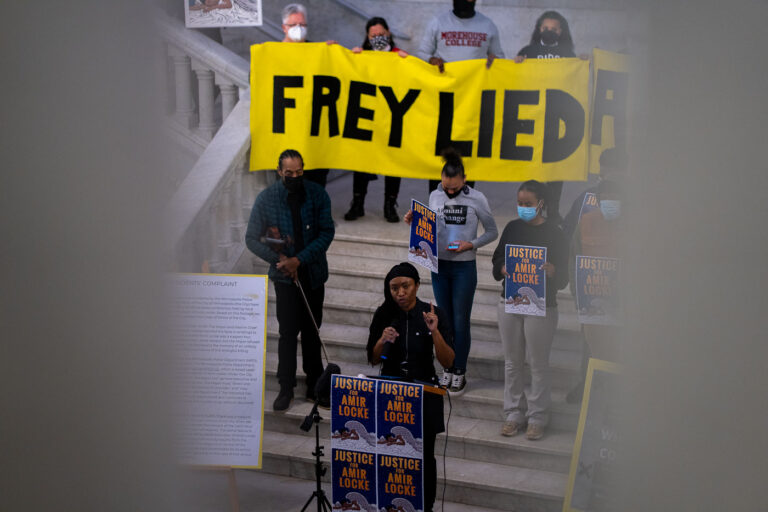 Minneapolis City Hall Protest for Amir Locke 2 Protesters gathered on the steps of Minneapolis City Hall to protest the police shooting death of Amir Locke. A large banner reading "FREY LIED" was displayed, referencing Mayor Jacob Frey. Demonstrators held signs with "JUSTICE for Amir Locke" and presented ethics complaints against the mayor to the city attorney's office. The event occurred following the February 2, 2022, shooting of Locke by Minneapolis Police officers during a no-knock warrant execution.