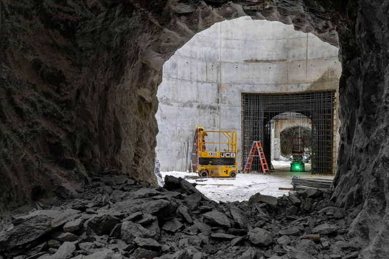 Rock-Bored Tunnel Chambers, I-35W Stormwater Storage Facility, Minneapolis 4 Yellow JCB lift inside MnDOT I-35W stormwater storage tunnel under construction in Minneapolis.