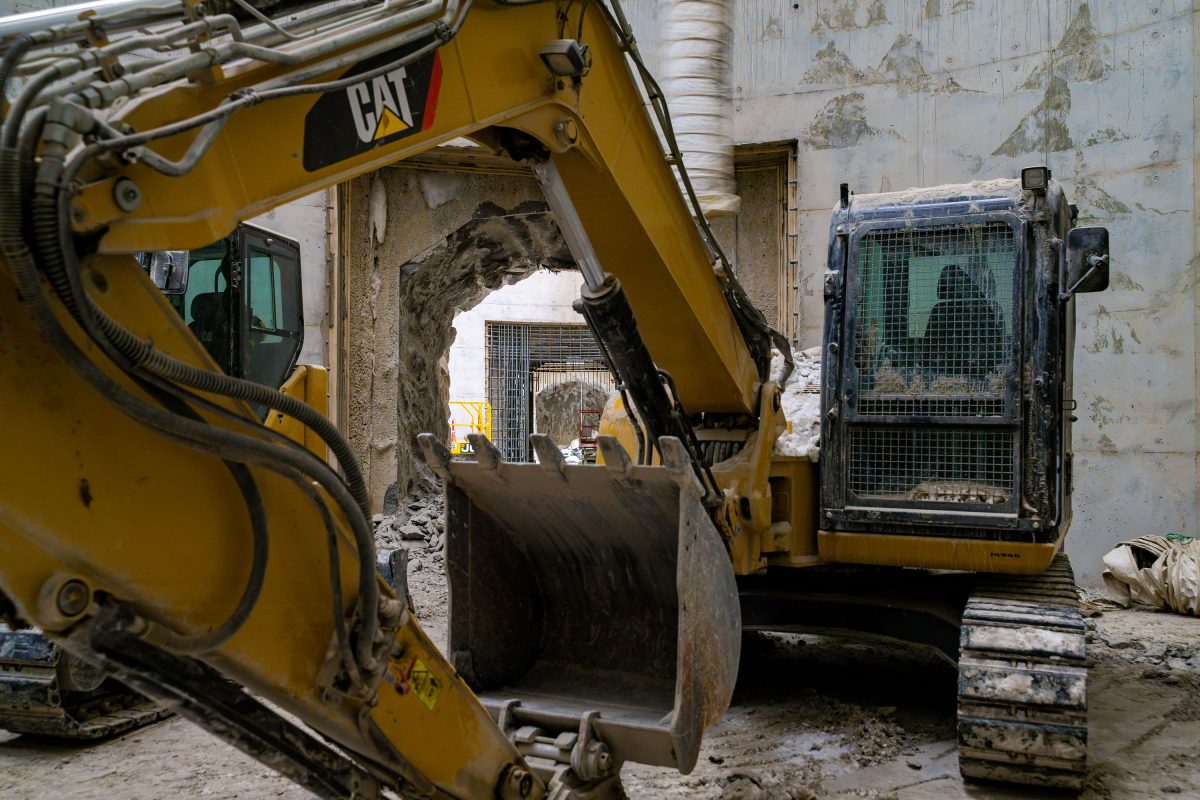 Skid Steer and Excavator Breach Concrete Wall, I-35W Stormwater Facility