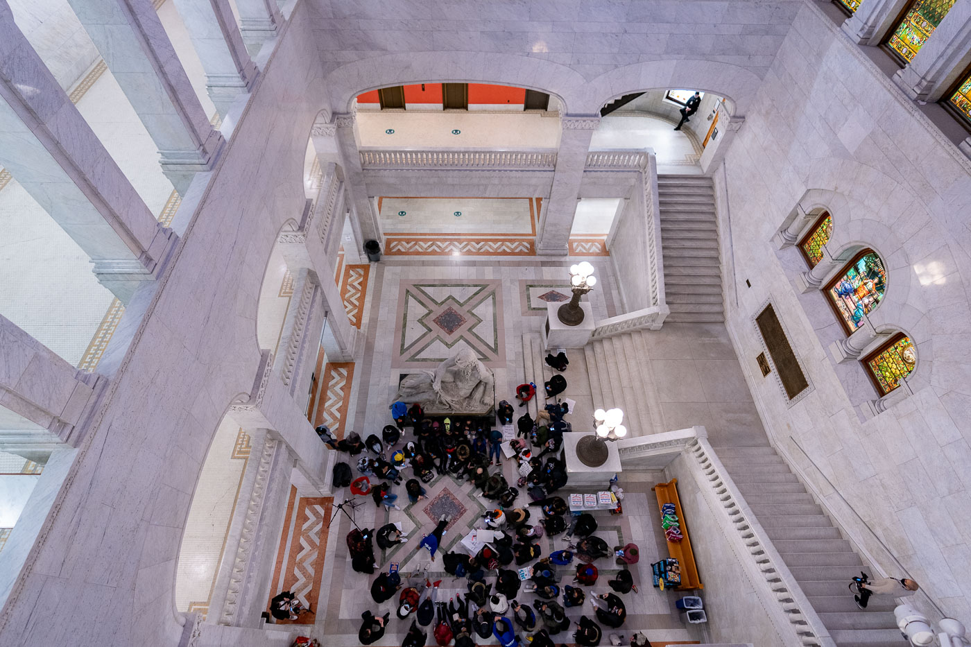 Students from Minneapolis North High School staged a protest at Minneapolis City Hall, demanding justice for Amir Locke and voicing their experiences with racial injustice. The students walked out of class to gather in the civic building, which serves as the seat of the city's government and a space for public discourse. Minneapolis City Hall, completed in 1909, is a Beaux-Arts structure designed by Long and Lamoreux. The protest highlights ongoing concerns about racial equity and policing in the city.