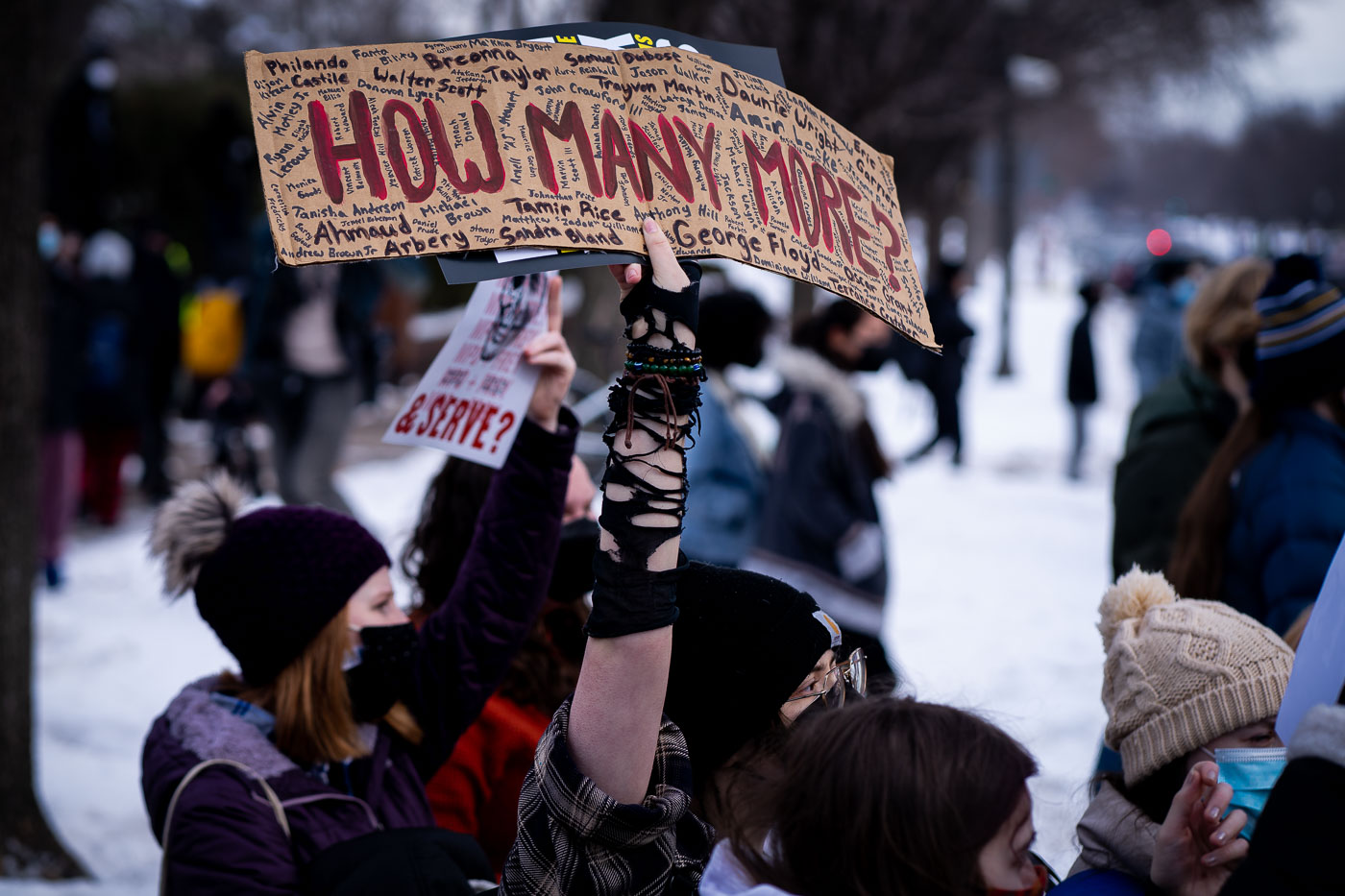 Students and activists gathered in St. Paul, Minnesota, to protest the killing of Amir Locke. Locke, a 22-year-old Black man, was killed by Minneapolis police during a no-knock warrant raid in February 2022. The protest, held near the Minnesota Governor's Residence, demanded justice for Locke and accountability from law enforcement. Signs carried by participants listed the names of individuals who have died in police encounters, questioning "How Many More?" This event is part of a broader movement advocating for police reform and an end to police brutality.
