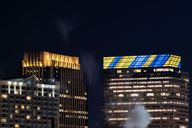 Target HQ Minneapolis Lights in Support of Ukraine 1 Target Headquarters in downtown Minneapolis was illuminated with blue and yellow lights, the colors of the Ukrainian flag, in a show of solidarity. The building, a prominent feature of the Minneapolis cityscape, serves as the corporate hub for the retail giant Target. This display of support occurred during a period of international concern regarding the conflict in Ukraine, reflecting a global response to the crisis. The lighting highlights the building's architectural features against the night sky, symbolizing a connection between local institutions and international events.