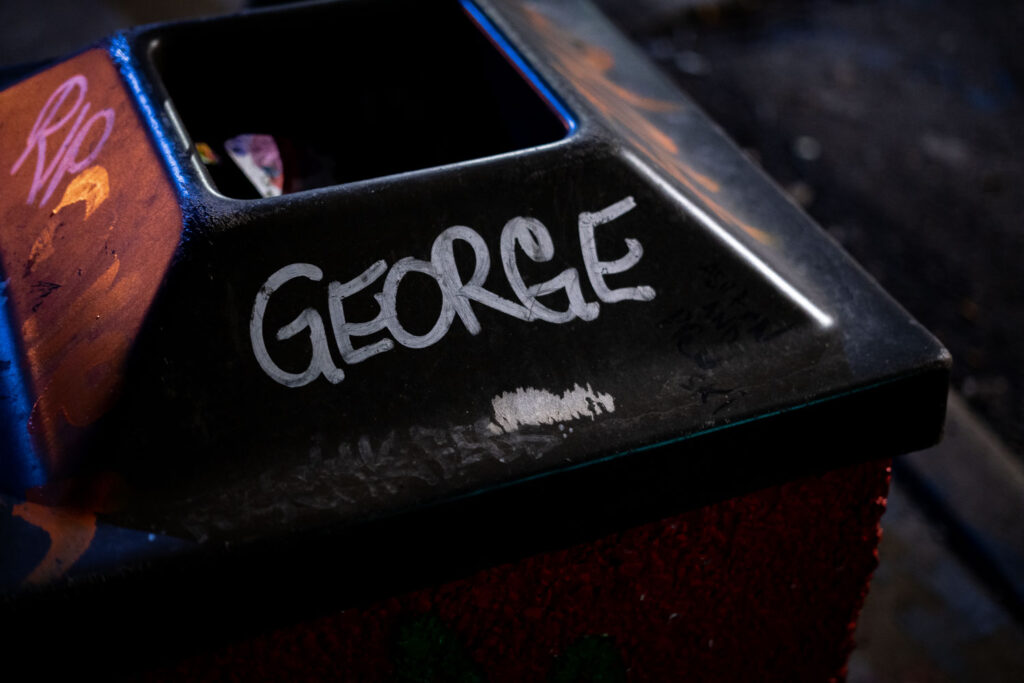"George" written on a garbage can at George Floyd Square.