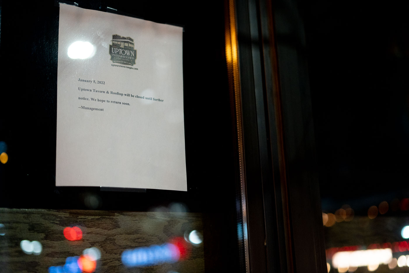 A notice dated January 5, 2022, announces the temporary closure of Uptown Tavern & Rooftop in Minneapolis. The closure was a response to increased crime and unrest in the Uptown area, which had experienced significant disturbances in the summer of 2020. The sign indicates the establishment would remain closed indefinitely, with management expressing a desire to reopen. This event underscores the vulnerability of urban businesses to localized safety concerns and social unrest.