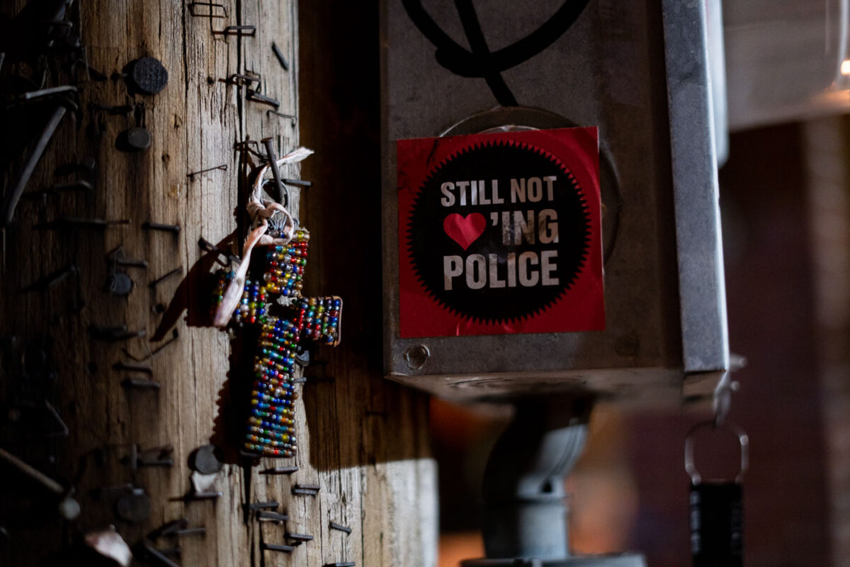 South Minneapolis: “Still Not Loving Police” Sticker and Beaded Cross