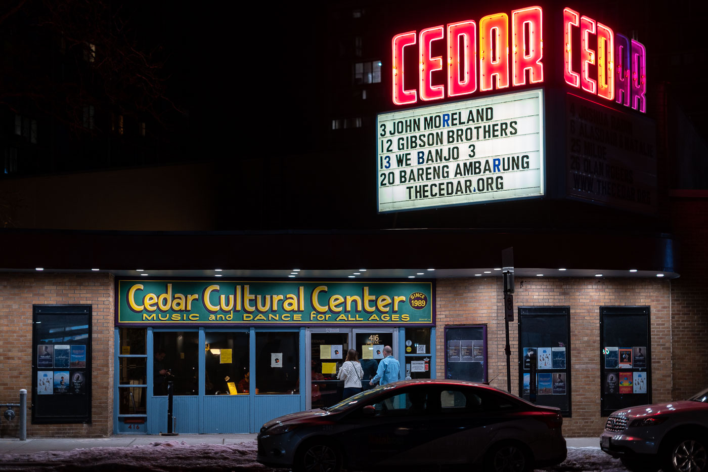 The Cedar Cultural Center, established in 1989, is a prominent music and dance venue located in Minneapolis's Cedar Riverside neighborhood. It serves as a vital cultural hub, presenting a wide array of performances and events for all ages. The marquee prominently advertises upcoming concerts, including a performance by John Moreland, underscoring the center's role in showcasing contemporary artists. The Cedar Cultural Center significantly contributes to the diverse cultural fabric of the Cedar Riverside area, a neighborhood known for its rich history and multicultural community.