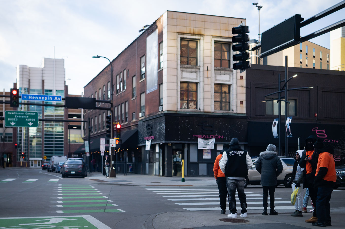 Violence Interrupters gather on Hennepin Avenue in downtown Minneapolis. This group works to de-escalate conflicts and prevent retaliatory violence within the community. Their presence in public spaces like this busy thoroughfare highlights ongoing efforts to address public safety concerns. Hennepin Avenue is a major commercial and cultural artery in Minneapolis, and its condition often reflects the broader social and economic dynamics of the city.