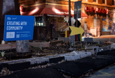 A sign placed by city regarding their "38th & Chicago Re-envisioned" plan. The city would hold community sessions to gather feedback in the days that followed.