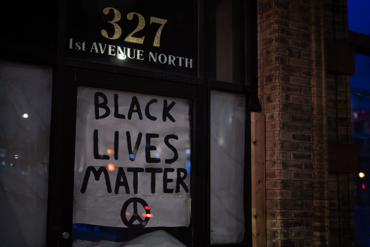 A "Black Lives Matter" sign covering a window in downtown Minneapolis.