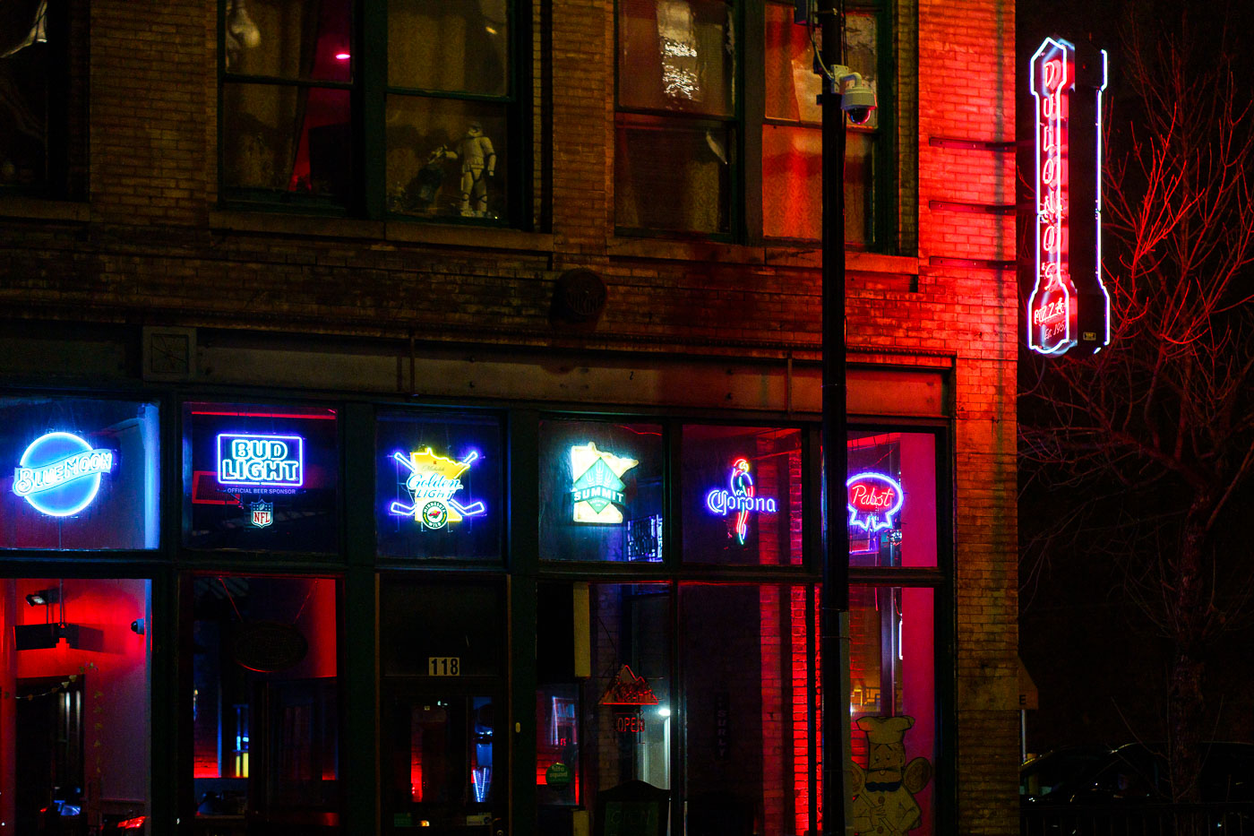 Dulono's Pizza sign lit at night in Downtown Minneapolis