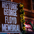 A sign reading "Historic George Floyd Memorial" at George Floyd Square.