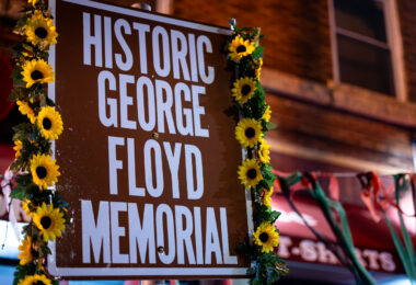 A sign reading "Historic George Floyd Memorial" at George Floyd Square.
